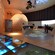 A contemporary exhibition area combining natural wood with digital equipment
